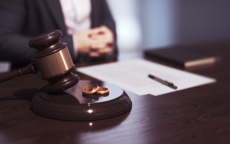 a gavel, wedding rings, and a lawyer